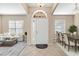 Bright and airy entryway with tile flooring, leading to living and dining areas at 9650 Bay Pine Ln, Orlando, FL 32832