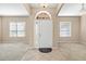 Spacious entryway with tile floor, showing access to the living and dining areas at 9650 Bay Pine Ln, Orlando, FL 32832