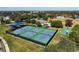 Aerial view of well-maintained community tennis courts and surrounding amenities at 9650 Bay Pine Ln, Orlando, FL 32832