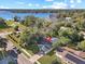 Aerial view of home with mature trees, landscaping, close to a beautiful lake at 1234 Lynwood Ave, Apopka, FL 32703