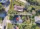 Aerial view of home in a neighborhood with mature trees and beautiful landscaping at 1234 Lynwood Ave, Apopka, FL 32703