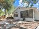 Screened patio with access to the backyard and view of the home's exterior at 1234 Lynwood Ave, Apopka, FL 32703