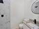 Modern bathroom featuring a granite countertop, marble tiled shower, and sleek fixtures at 1234 Lynwood Ave, Apopka, FL 32703