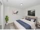 Staged bedroom with neutral carpet, a window, and a closet for storage at 1234 Lynwood Ave, Apopka, FL 32703