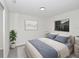 Bright bedroom featuring neutral walls, a comfortable bed with stylish bedding, and a sunny window at 1234 Lynwood Ave, Apopka, FL 32703