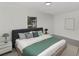 A stylish bedroom with a large bed, modern decor, and a serene color palette for relaxation at 1234 Lynwood Ave, Apopka, FL 32703