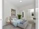 Cozy bedroom with a mirrored closet, natural light, and a neutral color scheme at 1234 Lynwood Ave, Apopka, FL 32703