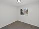 An empty bedroom features neutral paint and a window providing natural light to the room at 1234 Lynwood Ave, Apopka, FL 32703