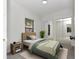 Cozy bedroom with a mirrored closet, natural light, and a neutral color scheme at 1234 Lynwood Ave, Apopka, FL 32703