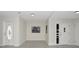Inviting entryway with neutral walls, stylish doors and plenty of natural light at 1234 Lynwood Ave, Apopka, FL 32703