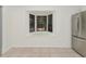 Bright kitchen features stainless steel appliances, granite countertops, and a bay window with backyard views at 1234 Lynwood Ave, Apopka, FL 32703