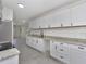 Bright kitchen with white cabinets, modern hardware, and beautiful granite countertops at 1234 Lynwood Ave, Apopka, FL 32703
