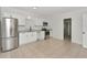 Bright kitchen features stainless steel appliances, granite countertops, and tile flooring at 1234 Lynwood Ave, Apopka, FL 32703