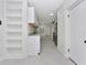 Modern kitchen featuring white cabinetry, granite countertops, and stainless steel appliances at 1234 Lynwood Ave, Apopka, FL 32703