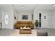 Cozy living room with a comfortable sofa, stylish decor, and plenty of natural light at 1234 Lynwood Ave, Apopka, FL 32703