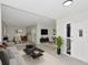 Bright, open living room featuring neutral colors and modern furnishings perfect for relaxation and entertainment at 1234 Lynwood Ave, Apopka, FL 32703