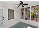 Enclosed patio area with ceiling fan and natural light offers space for outdoor relaxation at 1234 Lynwood Ave, Apopka, FL 32703