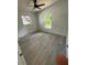 Cozy bedroom with new floors, neutral paint, and a large window for natural light at 1505 S Westmoreland Dr, Orlando, FL 32805