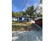 Attractive single-story home with a red-roofed carport and mature landscaping at 1505 S Westmoreland Dr, Orlando, FL 32805