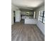 Bright and airy living space featuring an open layout and updated flooring at 1505 S Westmoreland Dr, Orlando, FL 32805