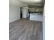 Inviting open-concept living room with modern gray flooring and bright white walls at 1505 S Westmoreland Dr, Orlando, FL 32805