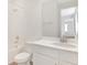 Bright bathroom featuring white fixtures, modern faucets, and a shower-tub combo with tiled walls at 1698 Sugarbelle Cir, Mascotte, FL 34753
