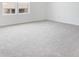 Neutral-toned bedroom featuring plush carpet and large windows offering plenty of natural light at 1698 Sugarbelle Cir, Mascotte, FL 34753