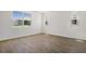 Bedroom featuring wood-look tile flooring and large window to let in natural light at 1698 Sugarbelle Cir, Mascotte, FL 34753