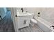 Bathroom with white vanity, bathtub, and gray flooring at 6817 Sw 131St Pl, Ocala, FL 34473