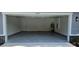 Two-car garage with epoxy flooring and extra storage space at 6817 Sw 131St Pl, Ocala, FL 34473