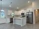 Modern kitchen with stainless steel appliances and white cabinets at 6817 Sw 131St Pl, Ocala, FL 34473