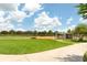 Community baseball field with green grass and a shaded dugout, perfect for practice or a game at 753 Largo Pass, Poinciana, FL 34759