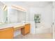 Bright bathroom featuring a soaking tub, vanity with ample counter space, and tile flooring at 753 Largo Pass, Poinciana, FL 34759
