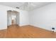 This bedroom has wood-look floors and an ensuite bathroom at 753 Largo Pass, Poinciana, FL 34759
