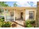 Charming front porch with decorative columns, a seating area, and a brick walkway at 753 Largo Pass, Poinciana, FL 34759