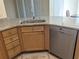 Kitchen area featuring a breakfast bar with granite counters and a stainless steel dishwasher at 753 Largo Pass, Poinciana, FL 34759