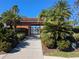 Community pool entrance with lush landscaping and a clear blue sky overhead at 753 Largo Pass, Poinciana, FL 34759