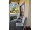 Cozy front porch with comfortable seating, offering a relaxing outdoor space at 753 Largo Pass, Poinciana, FL 34759
