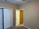 Bedroom featuring a double door closet at 8830 Dunes Ct # 12 207, Kissimmee, FL 34747