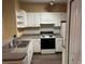 Well-lit kitchen with ample cabinet space and modern appliances at 8830 Dunes Ct # 12 207, Kissimmee, FL 34747
