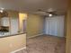 Spacious living room with carpet and sliding glass doors for natural light at 8830 Dunes Ct # 12 207, Kissimmee, FL 34747
