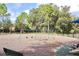 Community playground with swings, slides, and a safe, wood-chip ground cover at 8830 Dunes Ct # 12 207, Kissimmee, FL 34747