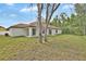Exterior view of the back of the house showing the large backyard at 314 Dagama Ct, Kissimmee, FL 34758