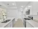 Modern kitchen featuring an island with quartz countertops and stainless steel appliances at 314 Dagama Ct, Kissimmee, FL 34758
