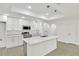 Modern kitchen featuring an island with quartz countertops, stainless steel appliances, and pendant lighting at 314 Dagama Ct, Kissimmee, FL 34758