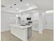Modern kitchen featuring an island with quartz countertops, stainless steel appliances, and pendant lighting at 314 Dagama Ct, Kissimmee, FL 34758