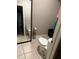 Modest bathroom with standard toilet, mirror, and neutral wall paint at 425 Blue Jacket Ln, Orlando, FL 32825
