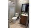 Standard bathroom featuring a shower, toilet, and vanity with neutral finishes at 425 Blue Jacket Ln, Orlando, FL 32825