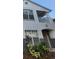 Two-story house exterior with festive wreath, landscaping, and balcony at 4320 S Kirkman Rd # 1513, Orlando, FL 32811
