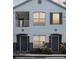 Charming two-story condo with a balcony, large windows, and well-manicured landscaping at 4368 S Kirkman Rd # 201, Orlando, FL 32811